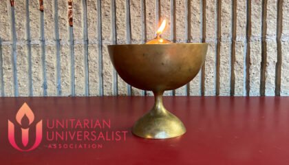 Lighted Chalice with Unitarian Universalist symbol
