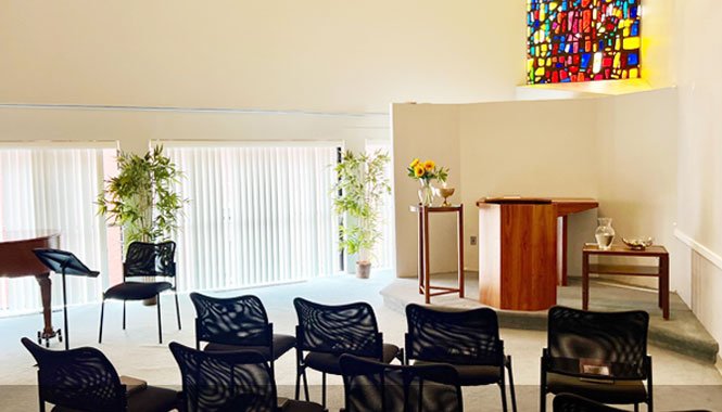 Hale Chapel with chairs and sunlight coming in a white room.