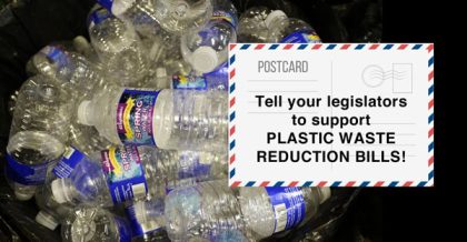 Water bottles in a pile with Postcard