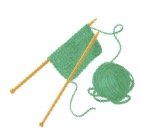 Two knitting needles with green nitted piece and ball of yarn