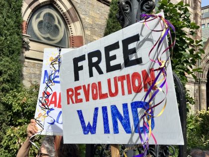 Sign says Free Revolution WInd